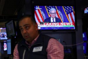 Read more about the article Dow, Nasdaq React to Powell’s Warning: Is a New Market Shock Coming in 2026?